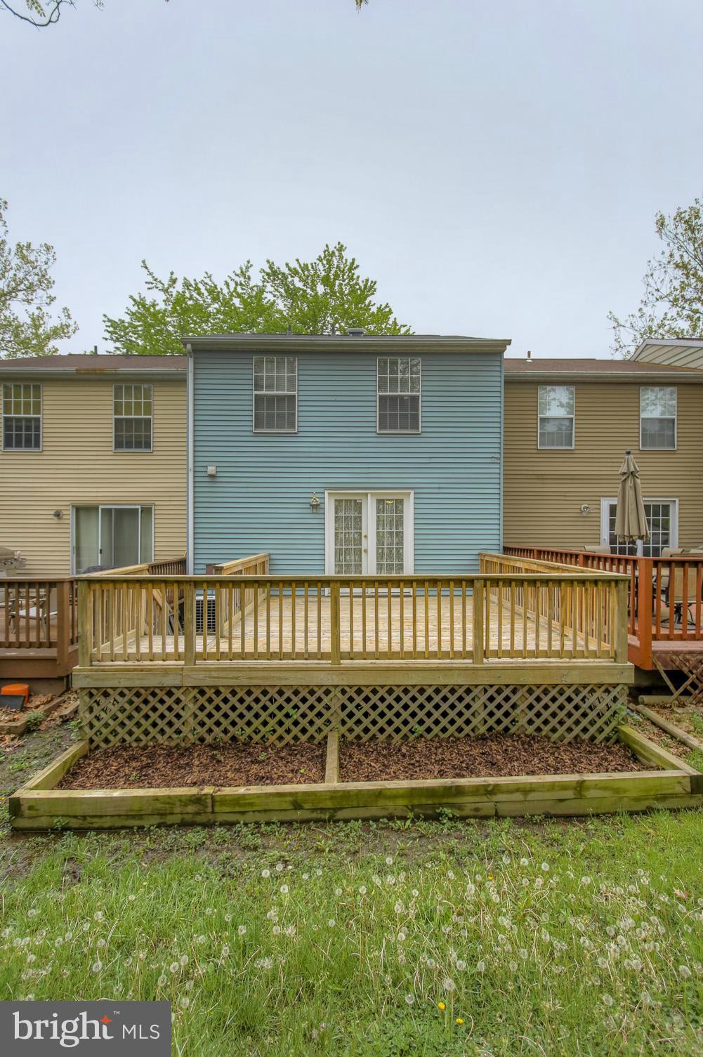 6358 Greenfield Road Elkridge, MD 21075 - Photo 25 of 28 Large deck with flowerbeds