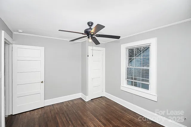 a view of room with hardwood floor and window