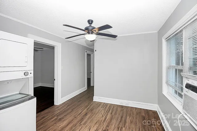 a view of a hallway with a kitchen