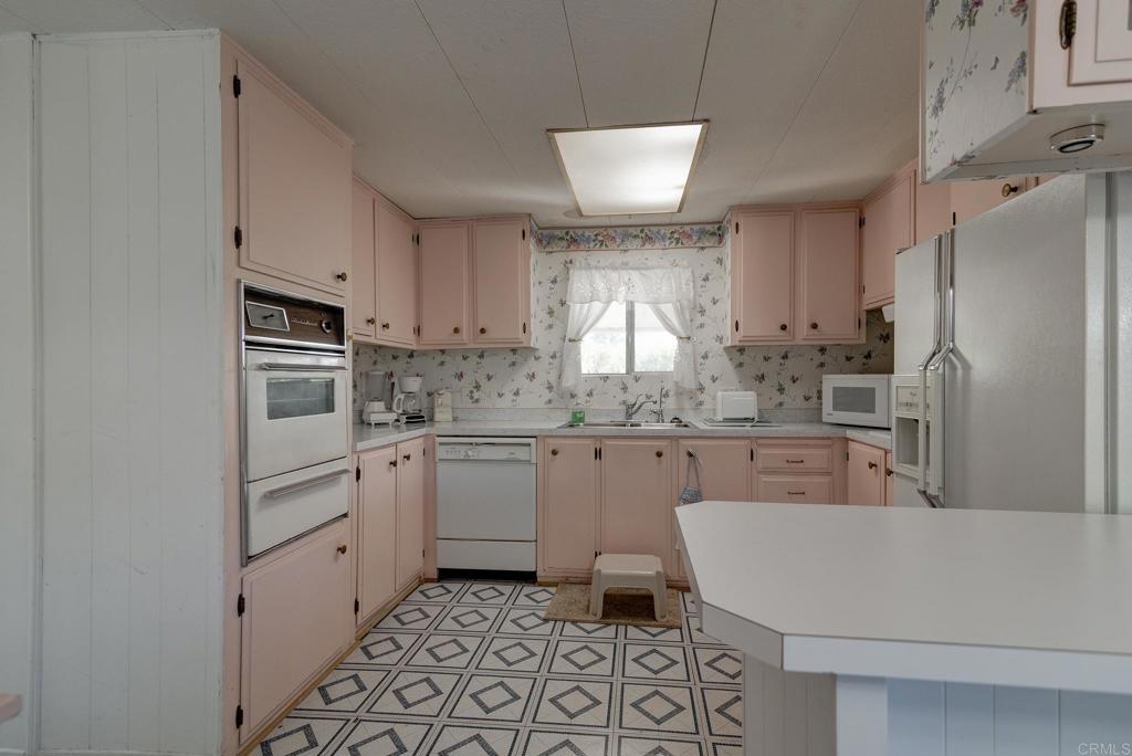 1010 Palm Canyon Drive, Unit 32 Borrego Springs, CA 92004 - Photo 1 of 13 a kitchen with granite countertop appliances cabinets and a sink