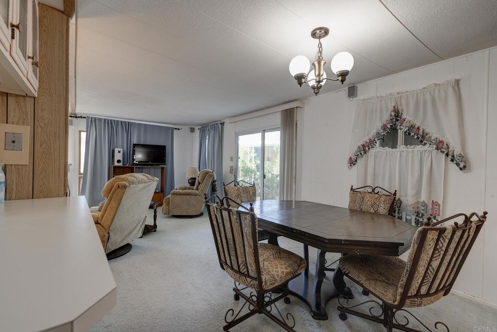 1010 Palm Canyon Drive, Unit 32 Borrego Springs, CA 92004 - Photo 2 of 13 a view of a dining room with furniture and chandelier