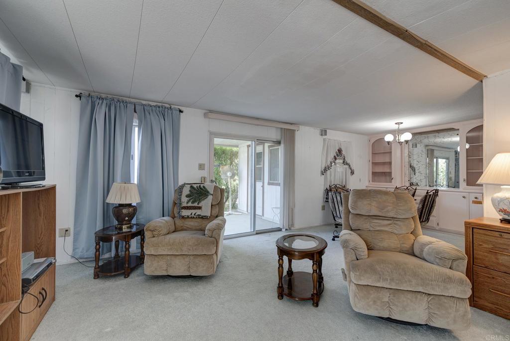 1010 Palm Canyon Drive, Unit 32 Borrego Springs, CA 92004 - Photo 4 of 13 a living room with furniture and a flat screen tv