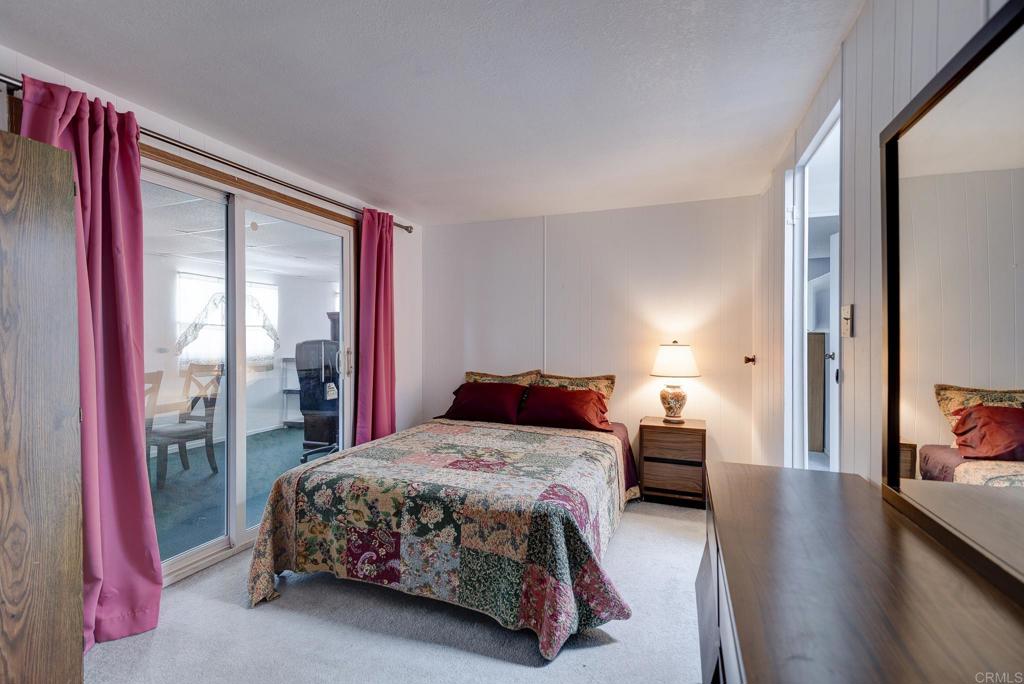 1010 Palm Canyon Drive, Unit 32 Borrego Springs, CA 92004 - Photo 5 of 13 a bedroom with a bed and wooden floor