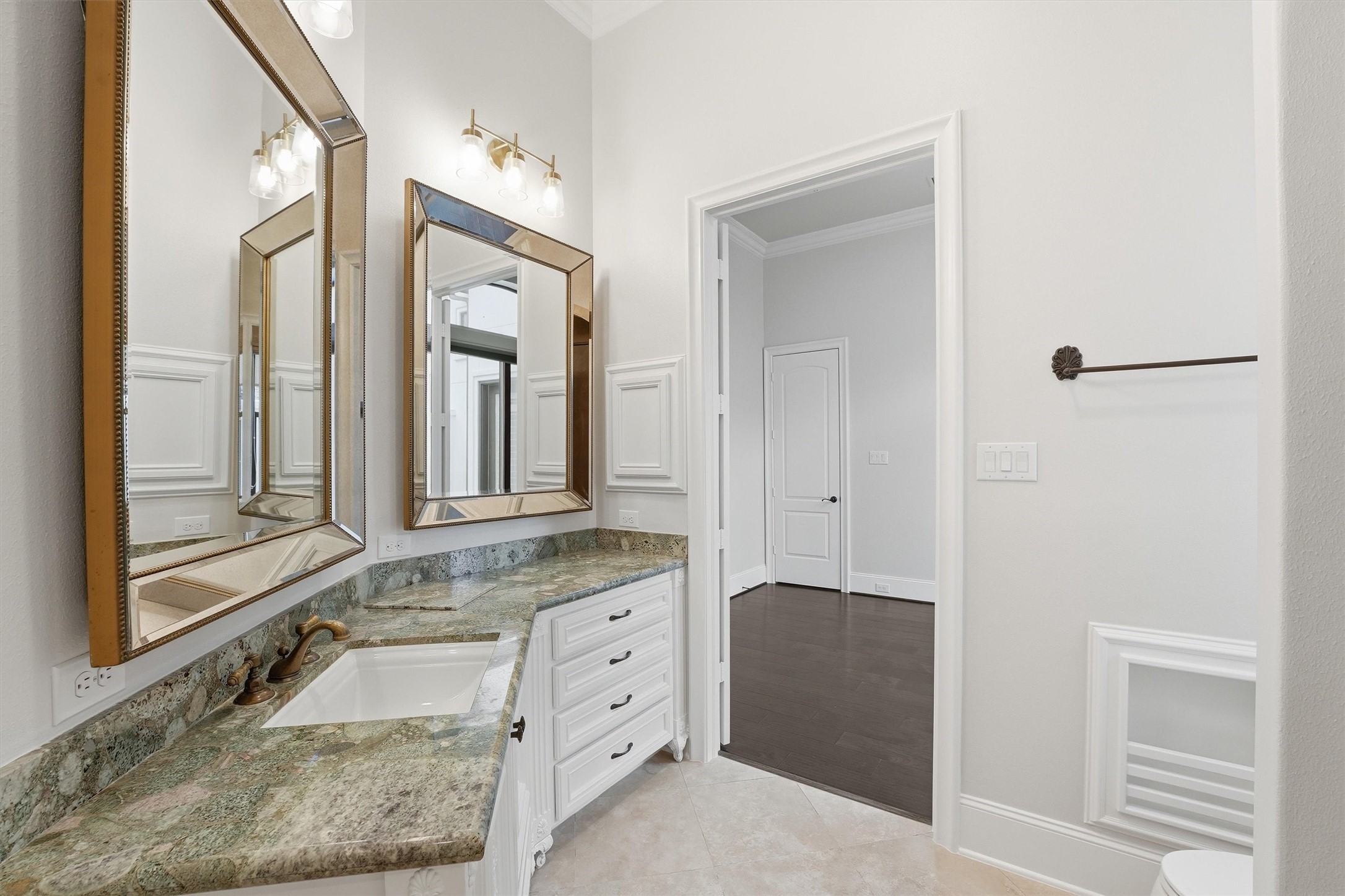 70 Quail Rock Place The Woodlands, TX 77381 - Photo 23 of 46 a bathroom with a granite countertop sink mirror and vanity