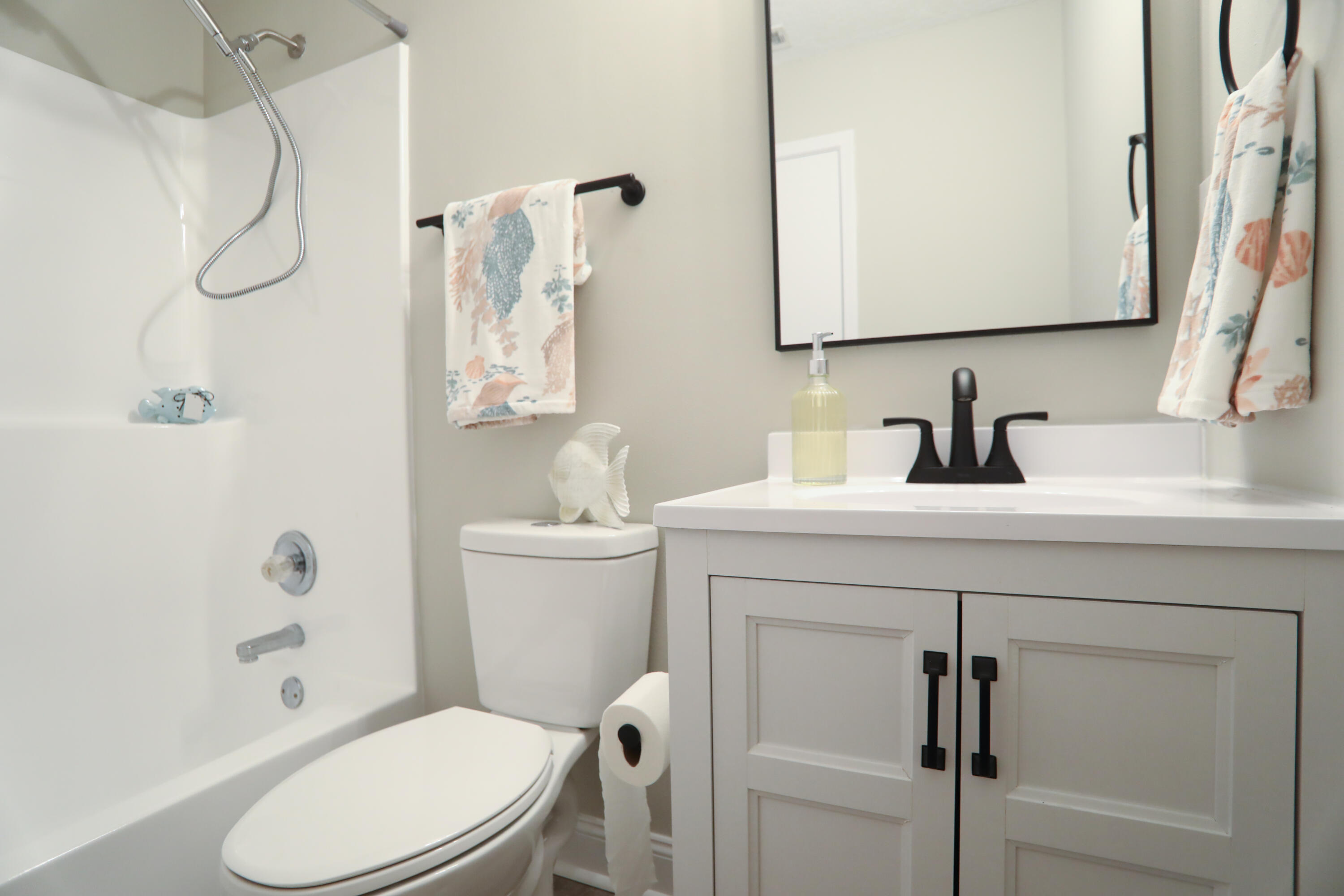 169 John King Road Crestview, FL 32539 - Photo 11 of 20 a bathroom with a sink mirror vanity and toilet