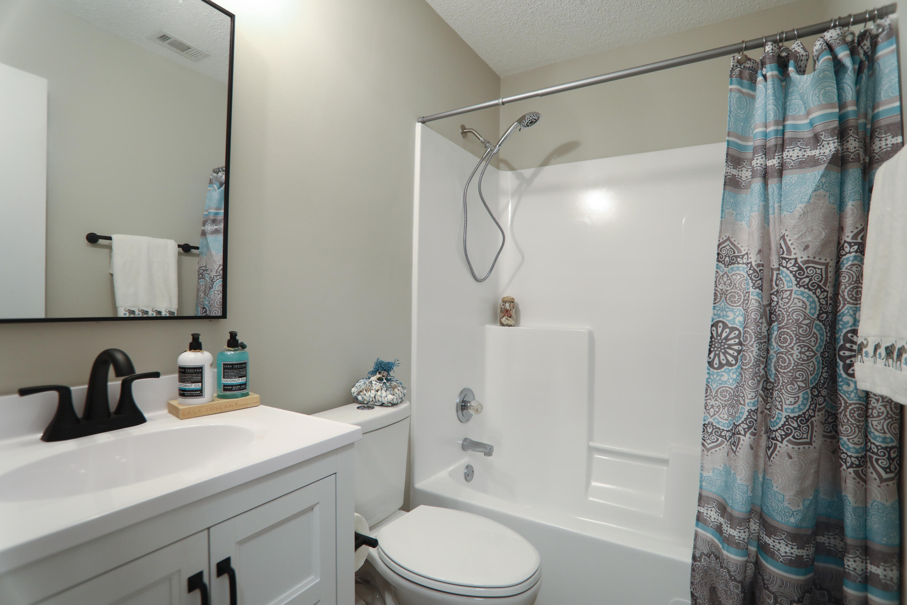 169 John King Road Crestview, FL 32539 - Photo 12 of 20 a bathroom with a sink toilet and shower