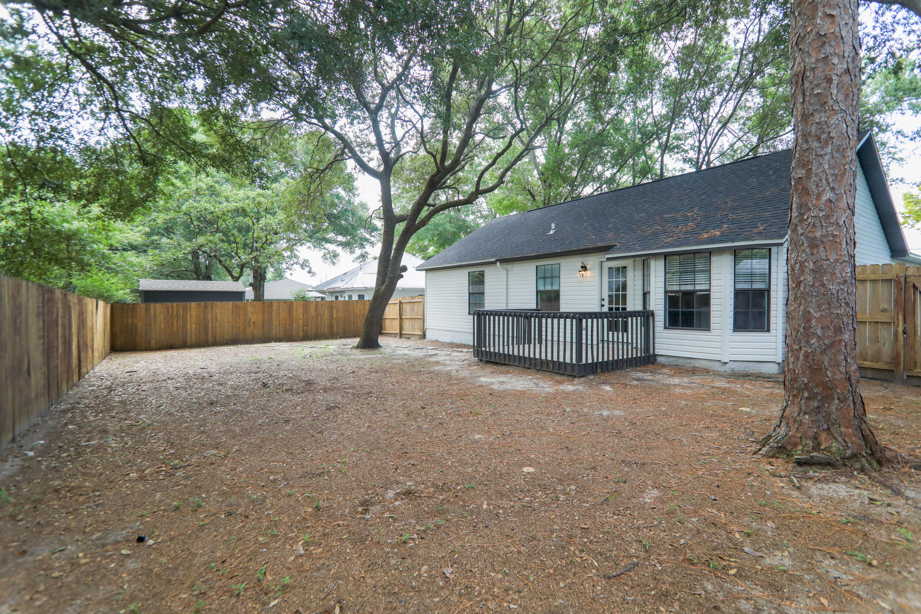 169 John King Road Crestview, FL 32539 - Photo 19 of 20 a view of a house with a yard and large tree