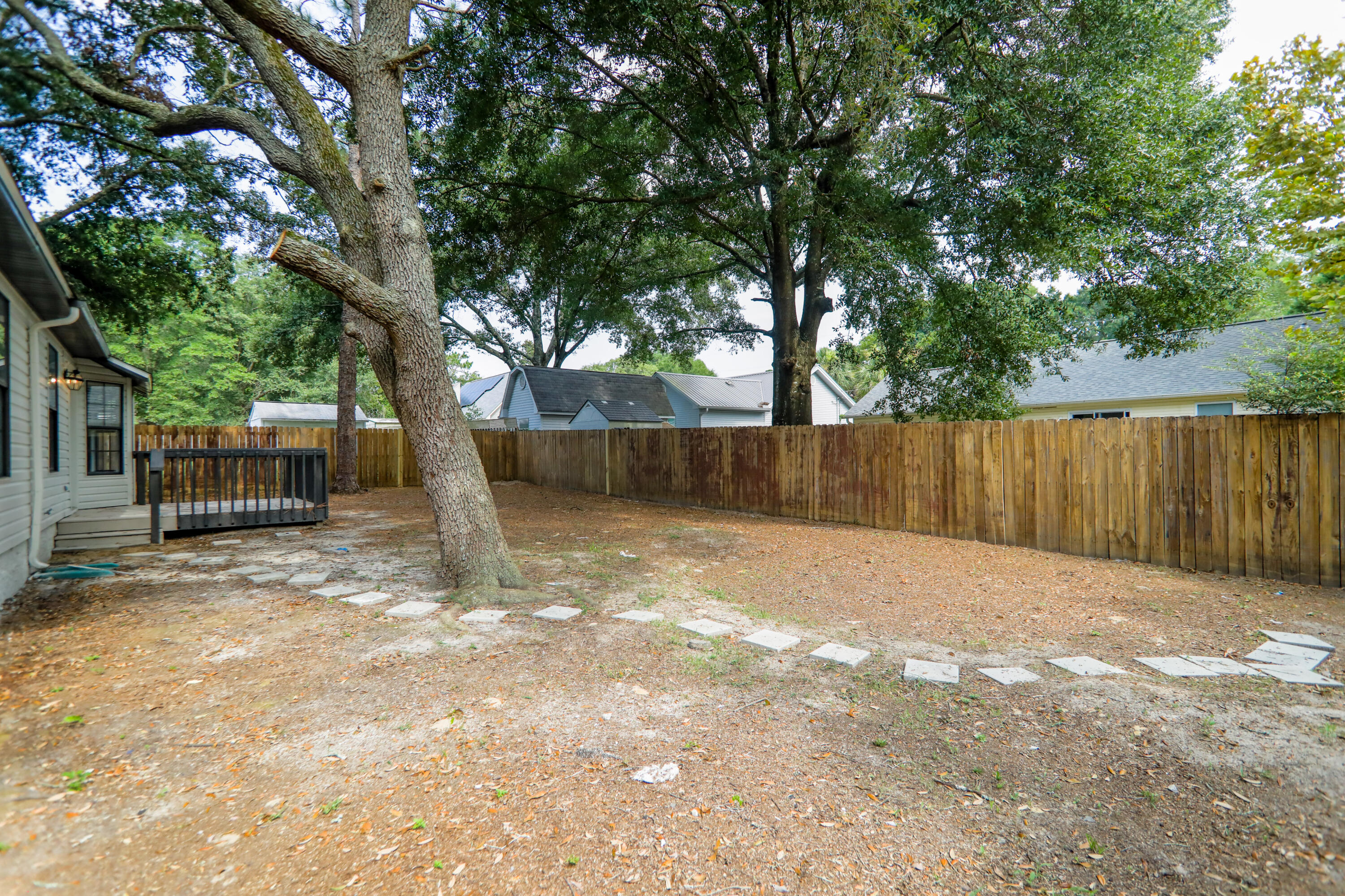 169 John King Road Crestview, FL 32539 - Photo 20 of 20 a backyard of a house with trees