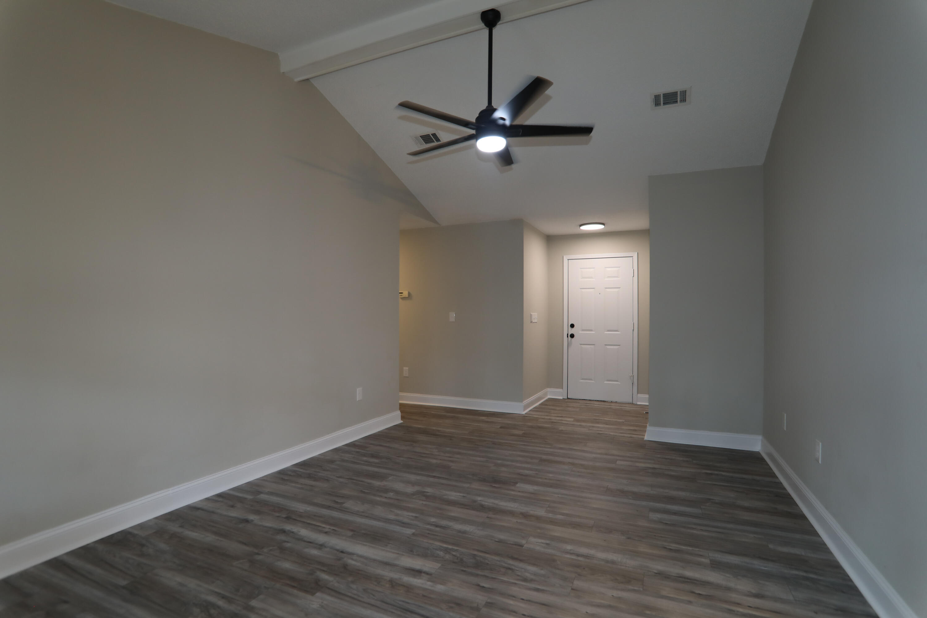 169 John King Road Crestview, FL 32539 - Photo 8 of 20 a view of an empty room with wooden floor