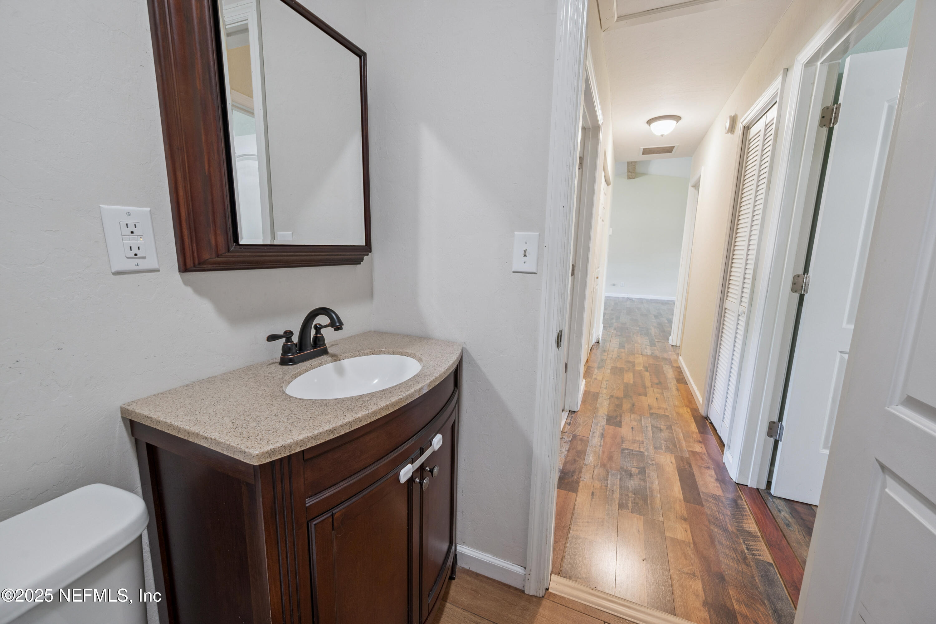 4881 Southwest 136th Court Lake Butler, FL 32054 - Photo 11 of 25 a bathroom with a sink and a mirror