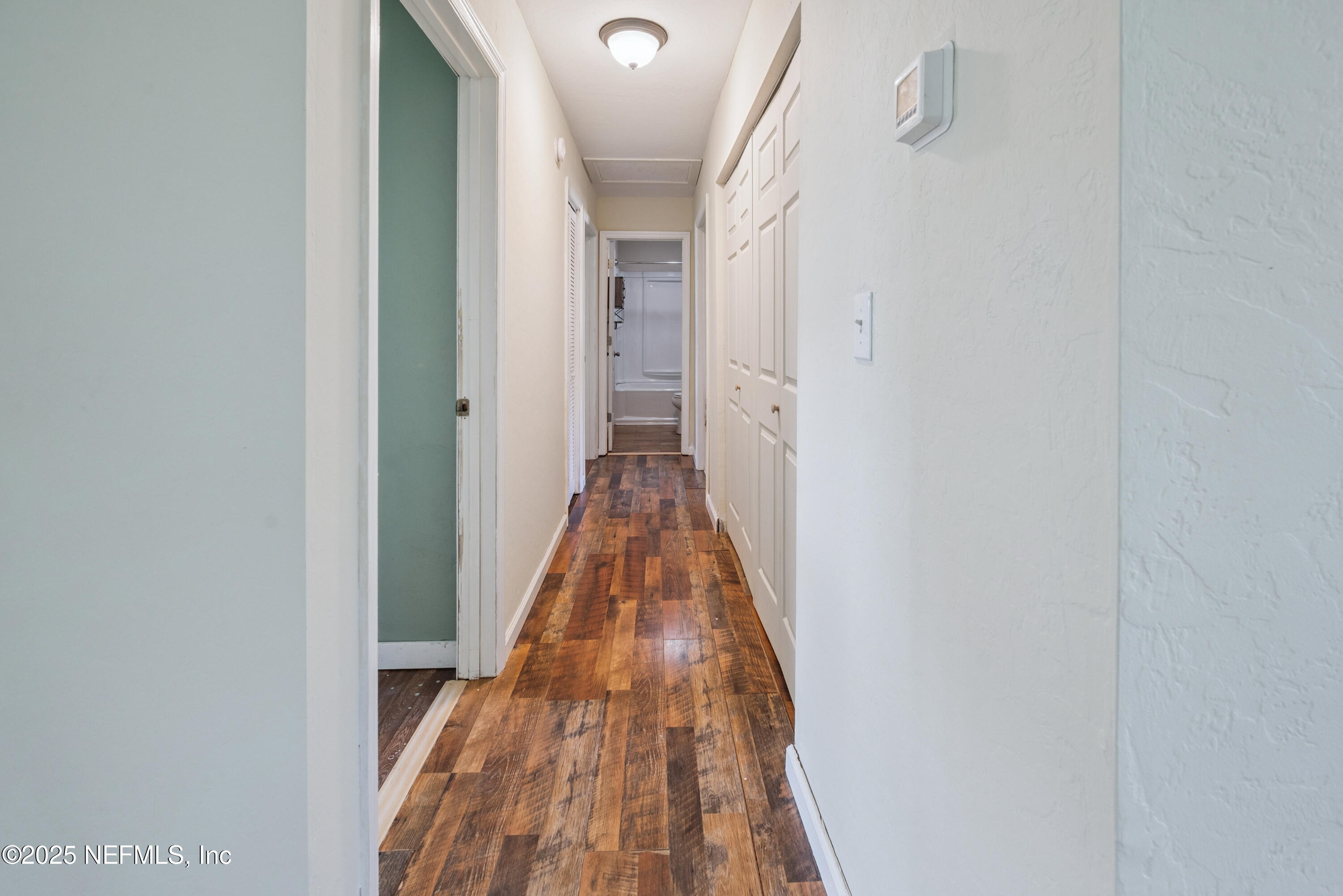 4881 Southwest 136th Court Lake Butler, FL 32054 - Photo 12 of 25 a view of a hallway with wooden floor and staircase