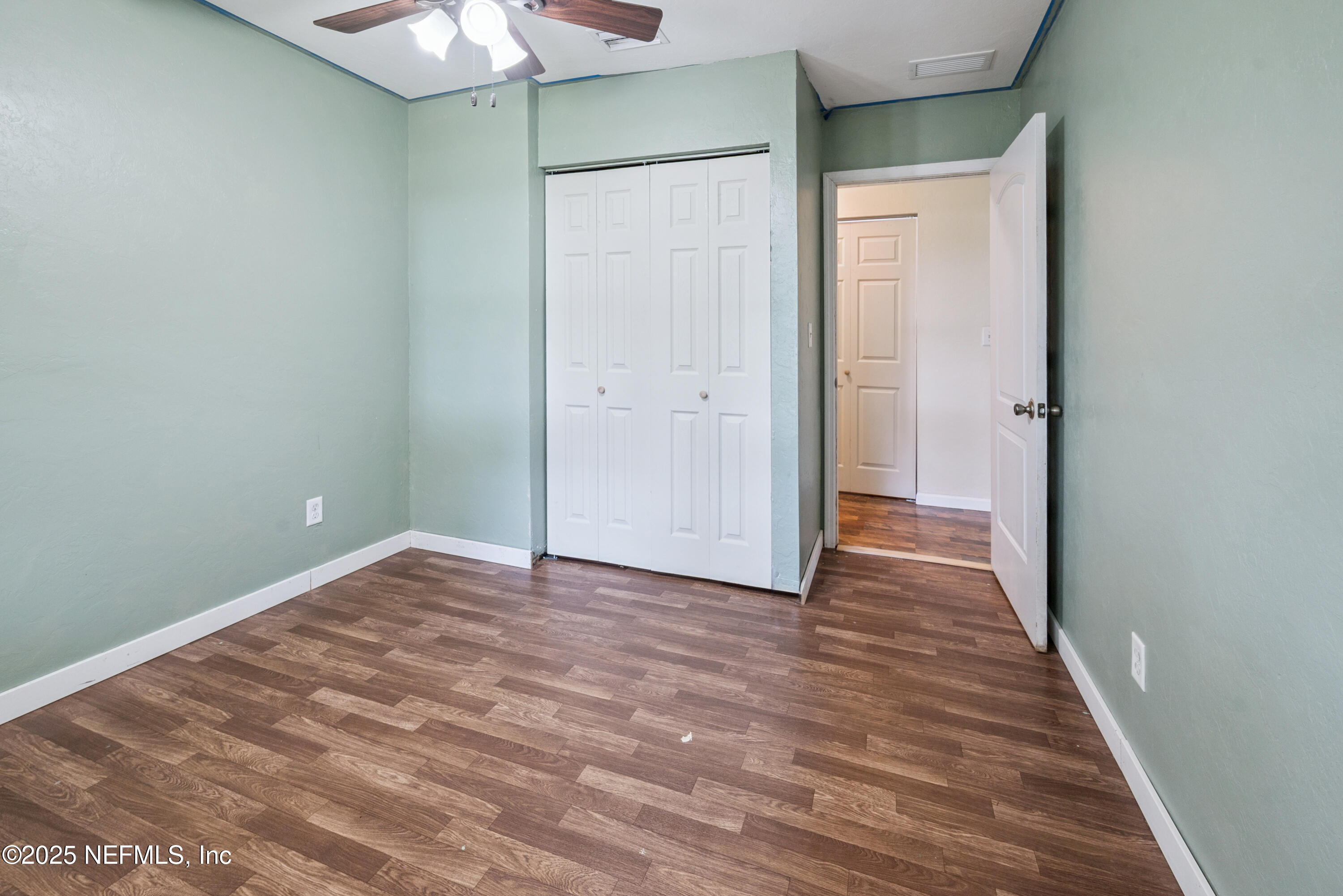 4881 Southwest 136th Court Lake Butler, FL 32054 - Photo 14 of 25 a view of an empty room with wooden floor