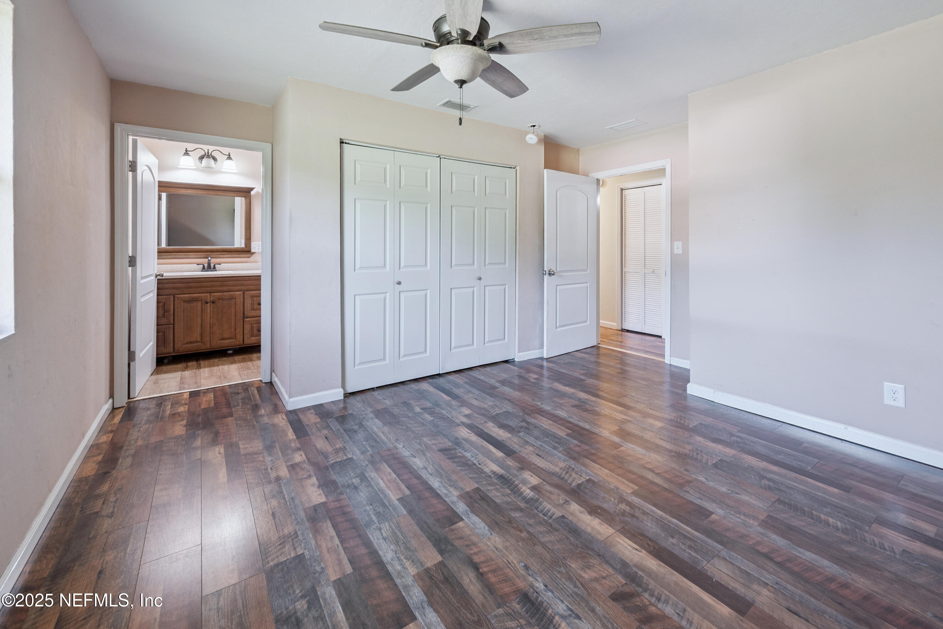 4881 Southwest 136th Court Lake Butler, FL 32054 - Photo 19 of 25 a view of a hallway with wooden floor and a kitchen