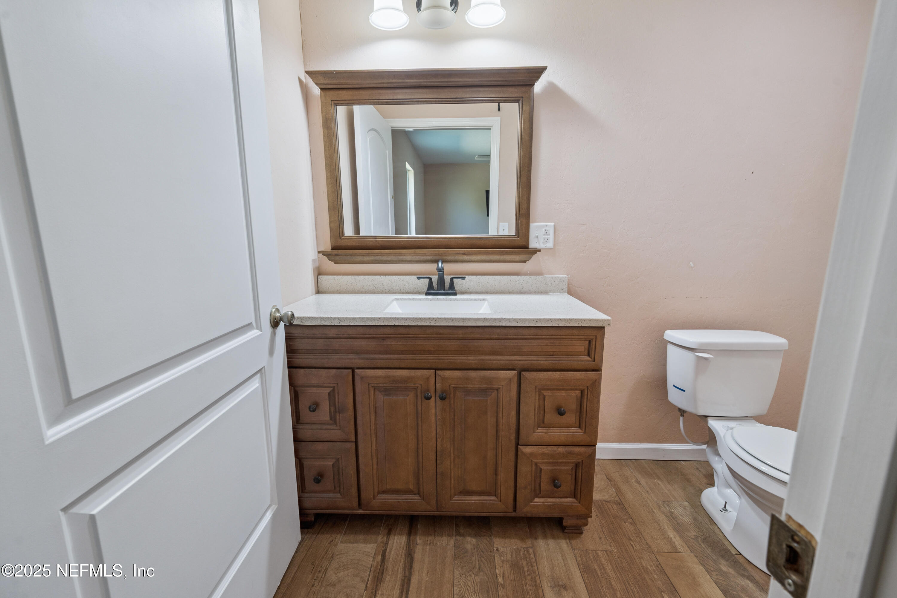 4881 Southwest 136th Court Lake Butler, FL 32054 - Photo 20 of 25 a bathroom with a sink and a mirror