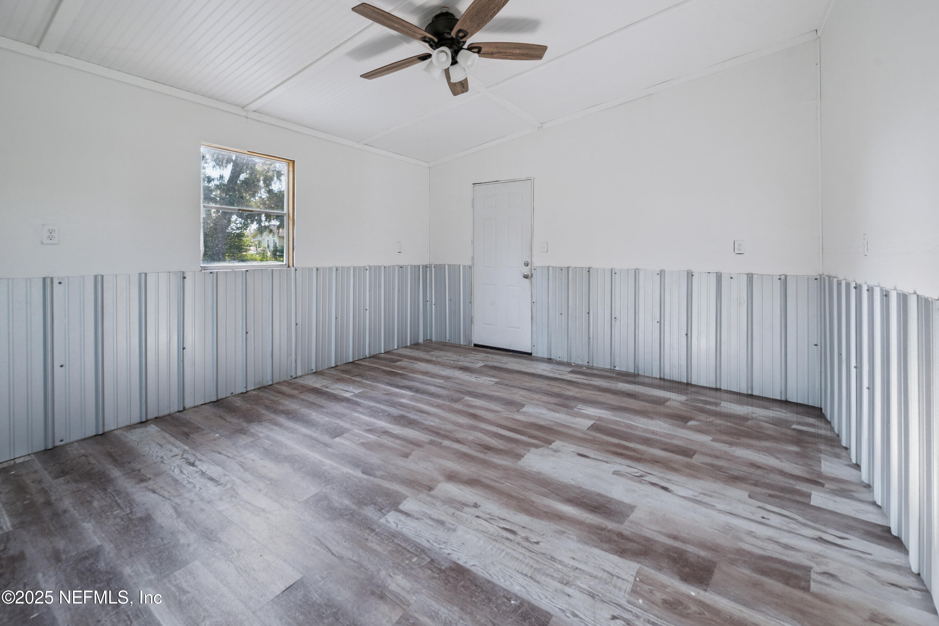 4881 Southwest 136th Court Lake Butler, FL 32054 - Photo 21 of 25 a view of an empty room with wooden floor