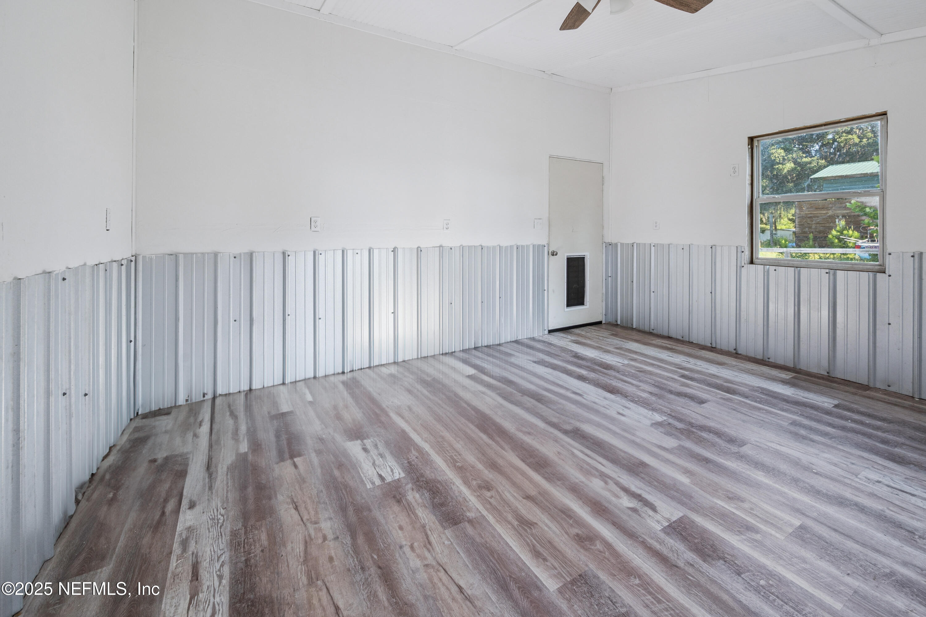 4881 Southwest 136th Court Lake Butler, FL 32054 - Photo 25 of 25 a view of wooden floor and windows in a room
