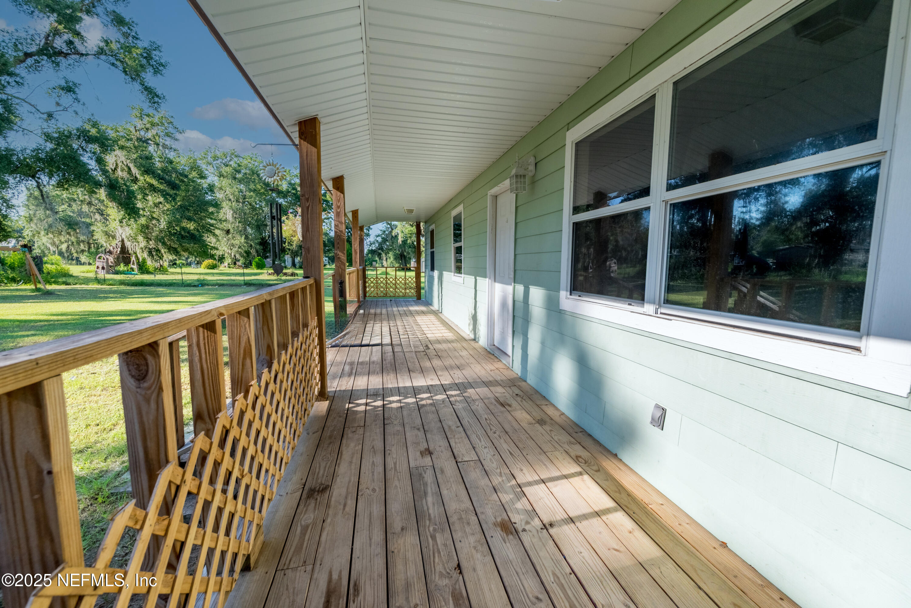 4881 Southwest 136th Court Lake Butler, FL 32054 - Photo 3 of 25 a view of a balcony with wooden floor