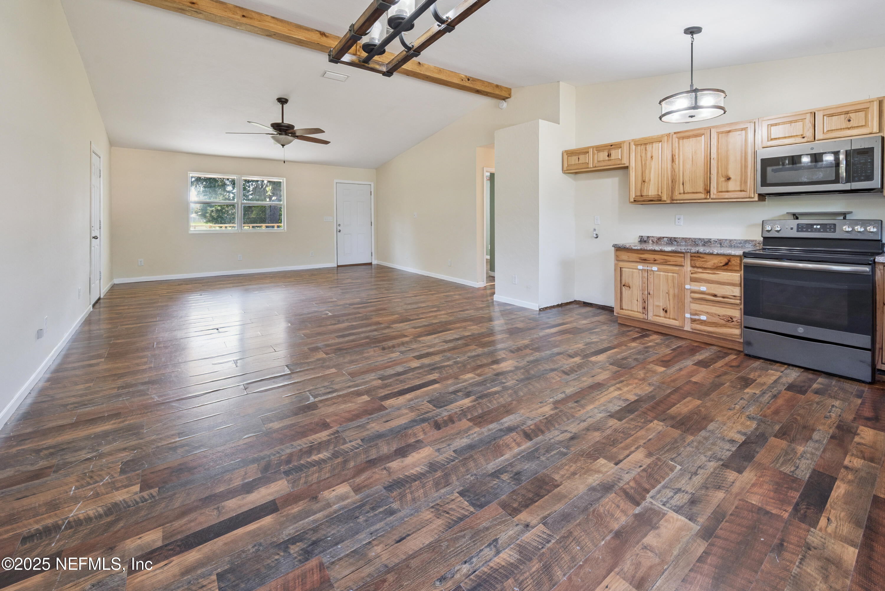 4881 Southwest 136th Court Lake Butler, FL 32054 - Photo 8 of 25 a view of kitchen with sink microwave and stove top oven