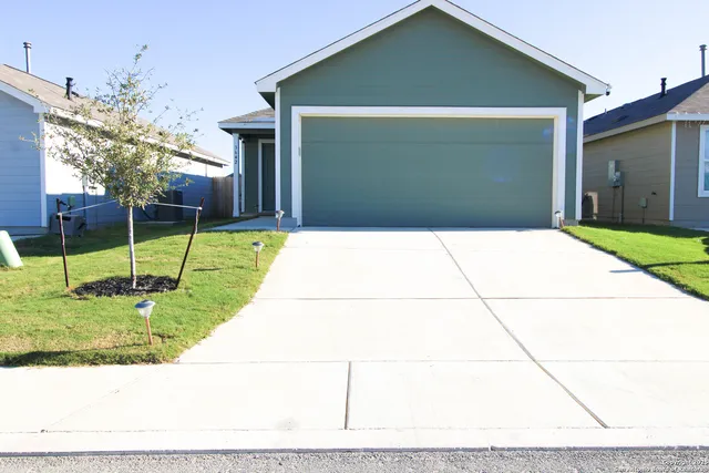 a house view with a backyard space