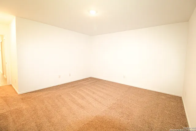 a bathroom with a granite countertop sink toilet a large mirror and shower