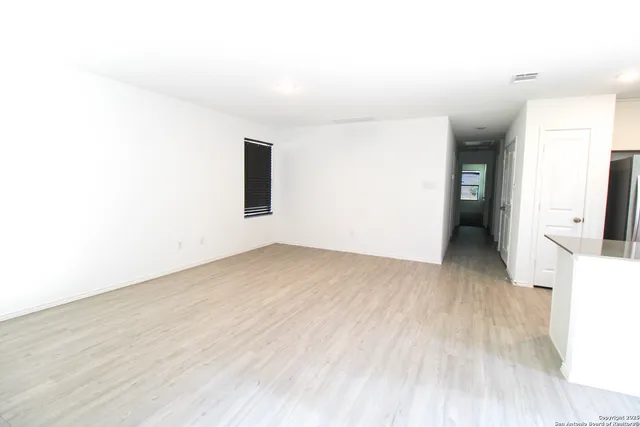 a view of a backyard of the house