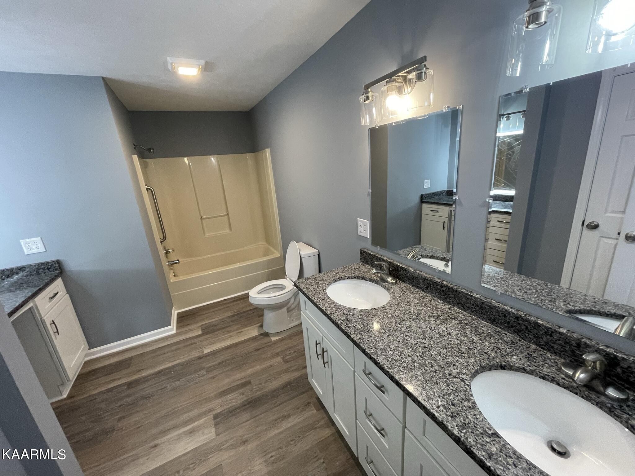 7170 Cedar Hill Road Talbott, TN 37877 - Photo 11 of 27 a bathroom with a granite countertop double vanity sink and a mirror