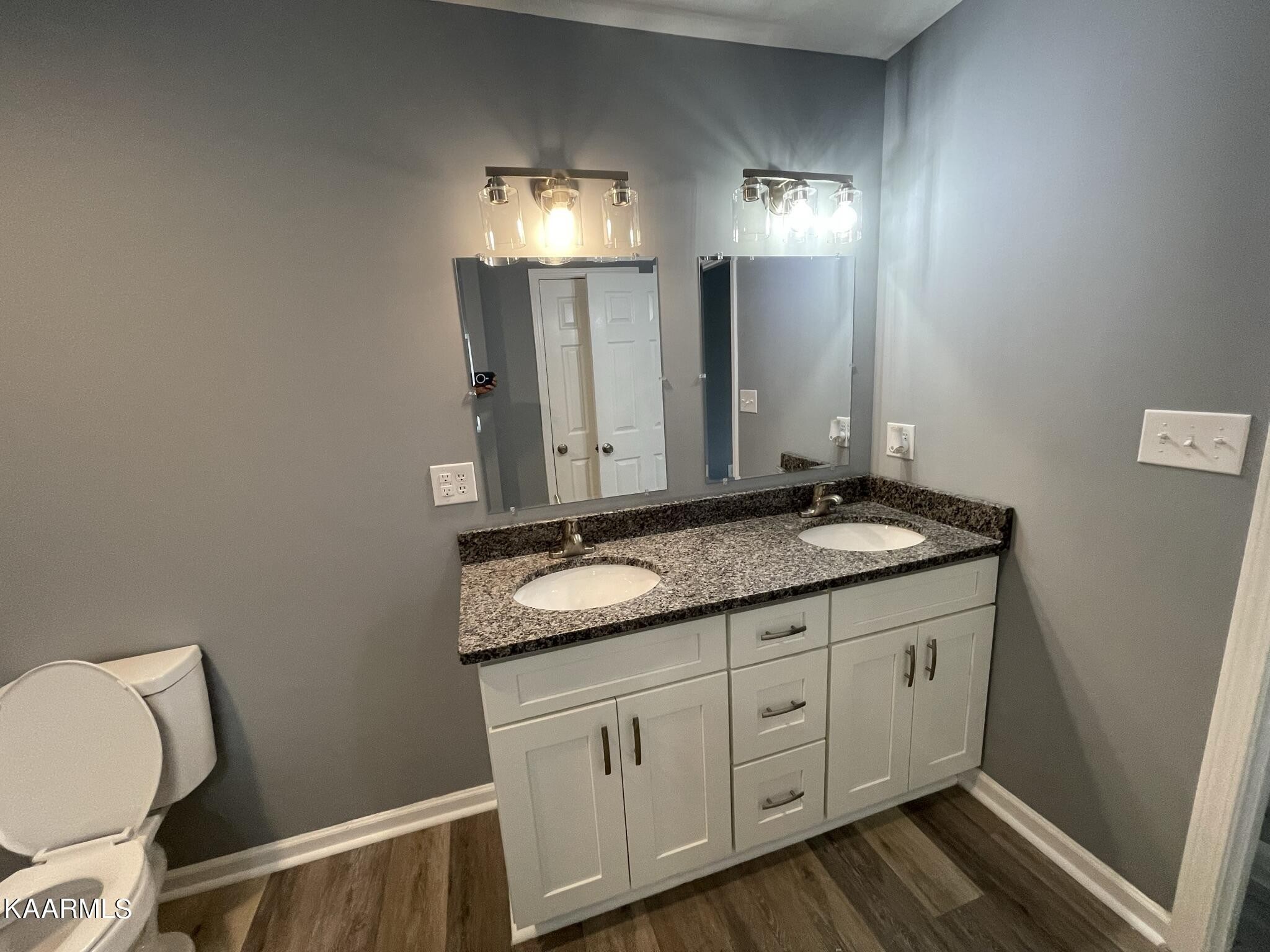 7170 Cedar Hill Road Talbott, TN 37877 - Photo 12 of 27 a bathroom with a granite countertop sink and a mirror