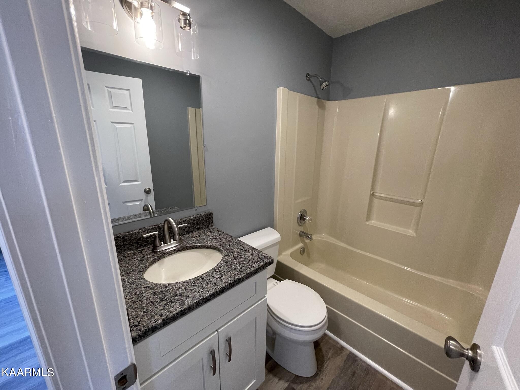 7170 Cedar Hill Road Talbott, TN 37877 - Photo 16 of 27 a bathroom with a granite countertop sink toilet and shower
