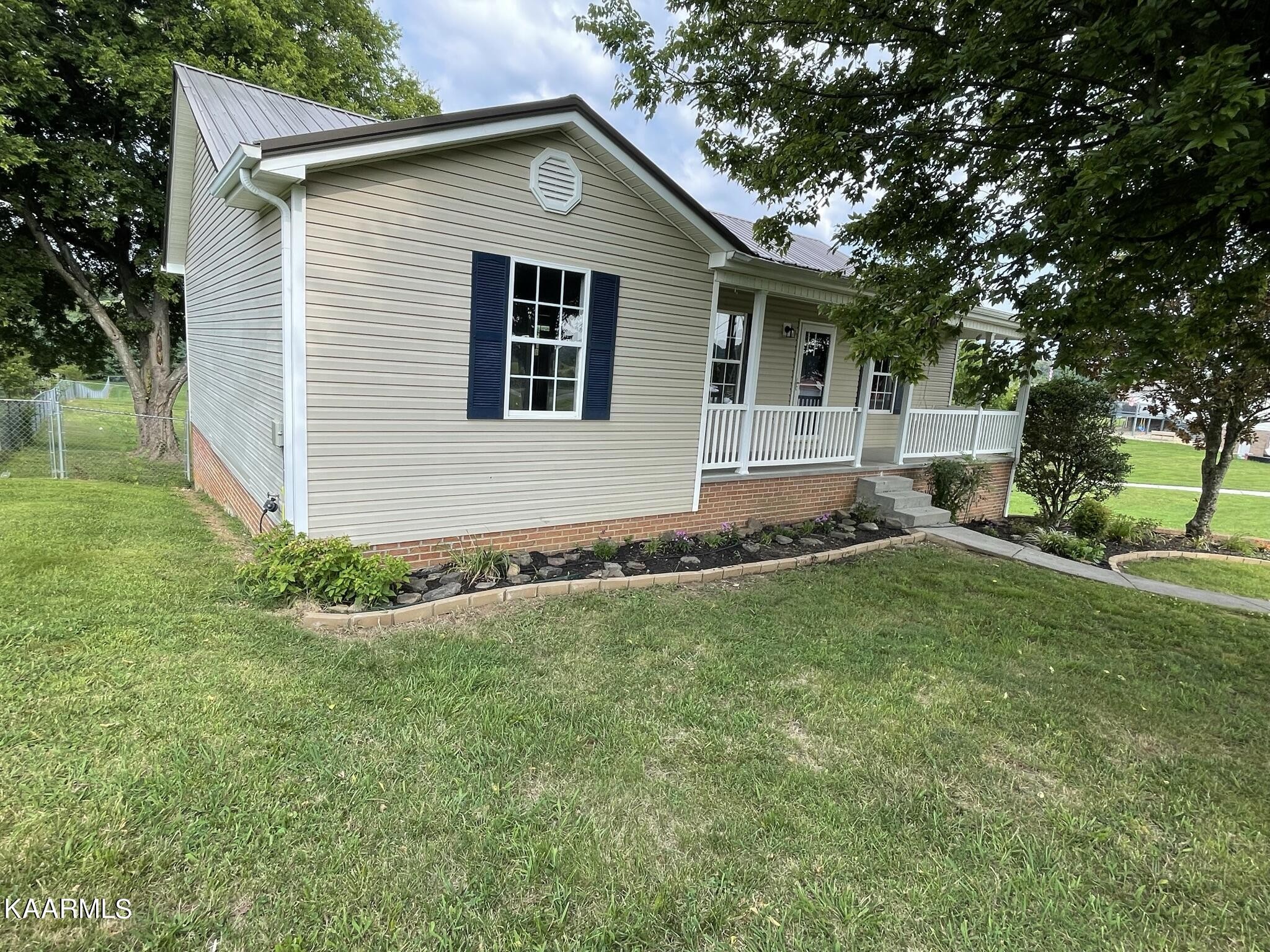 7170 Cedar Hill Road Talbott, TN 37877 - Photo 21 of 27 a front view of house with yard and green space