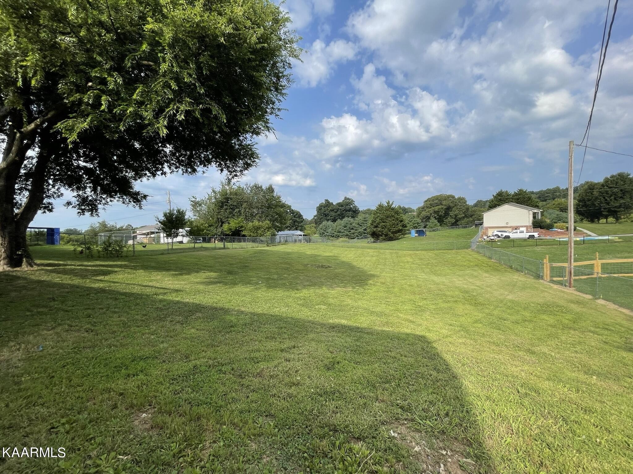 7170 Cedar Hill Road Talbott, TN 37877 - Photo 26 of 27 a view of a golf course with a garden
