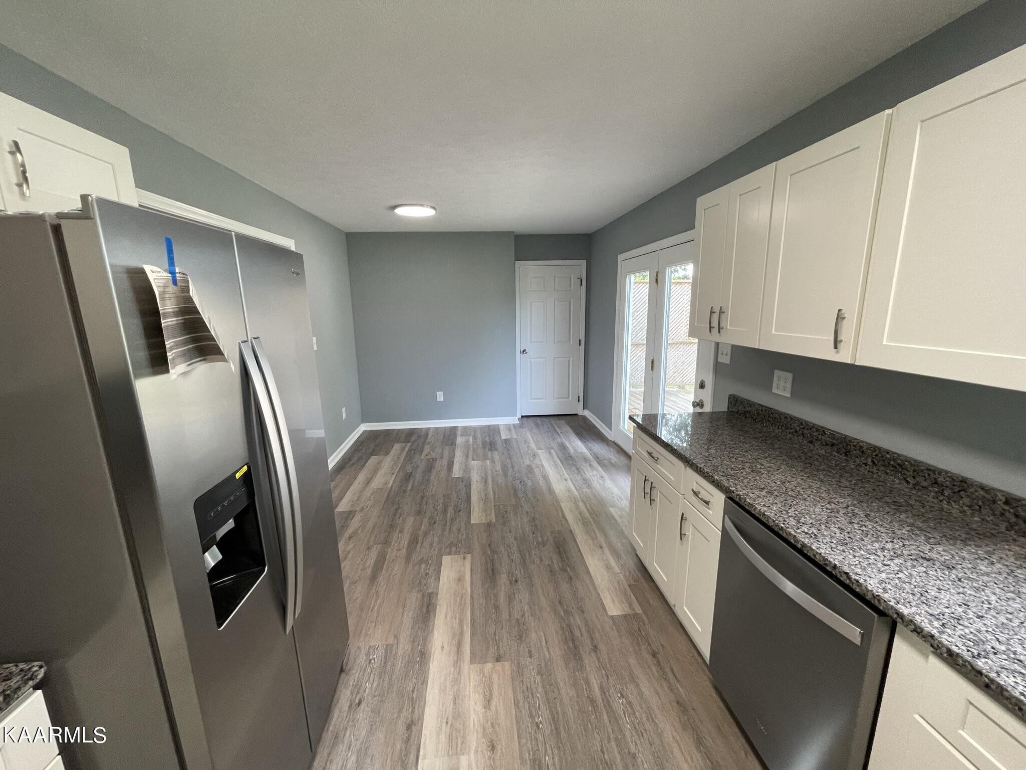 7170 Cedar Hill Road Talbott, TN 37877 - Photo 8 of 27 a kitchen with stainless steel appliances granite countertop a refrigerator a sink and wooden cabinets