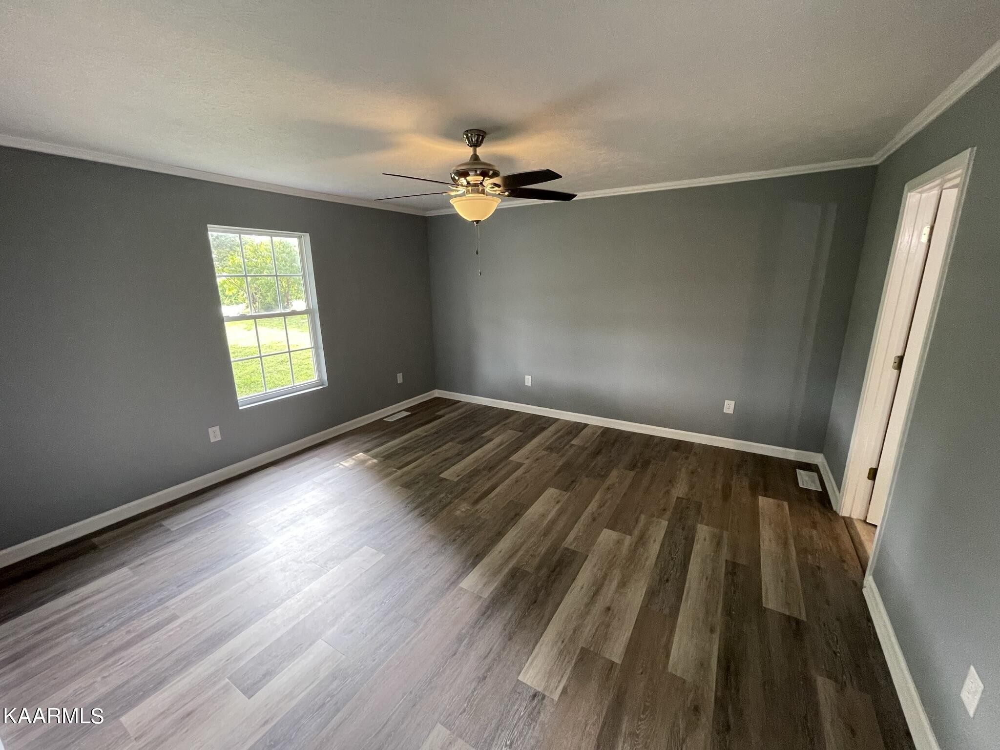 7170 Cedar Hill Road Talbott, TN 37877 - Photo 9 of 27 wooden floor in an empty room with a window