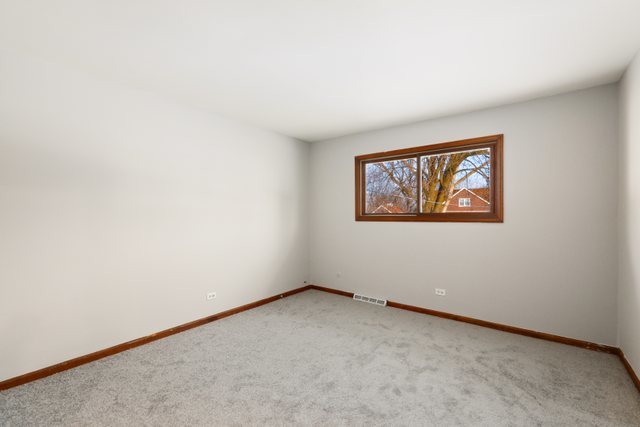 2394 Elm Road West Chicago, IL 60185 - Photo 13 of 28 an empty room with a window