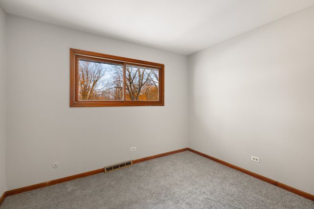 2394 Elm Road West Chicago, IL 60185 - Photo 15 of 28 an empty room with a window