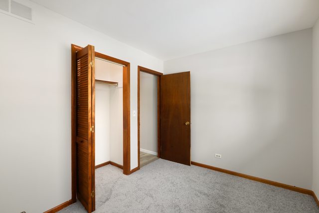 2394 Elm Road West Chicago, IL 60185 - Photo 16 of 28 an empty room with closet
