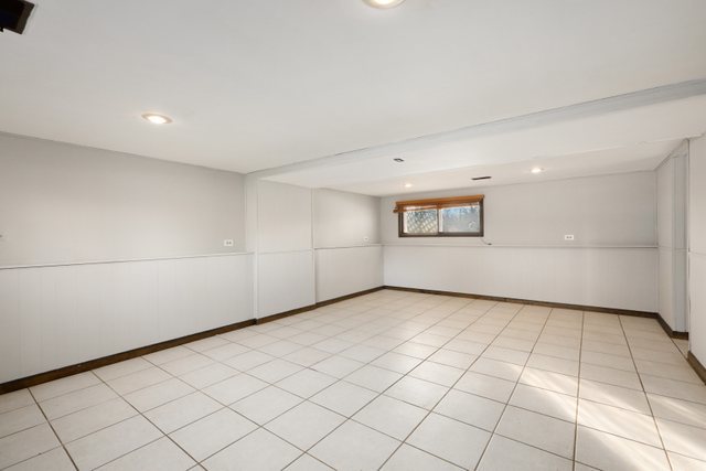2394 Elm Road West Chicago, IL 60185 - Photo 18 of 28 a view of a room with a window and a refrigerator