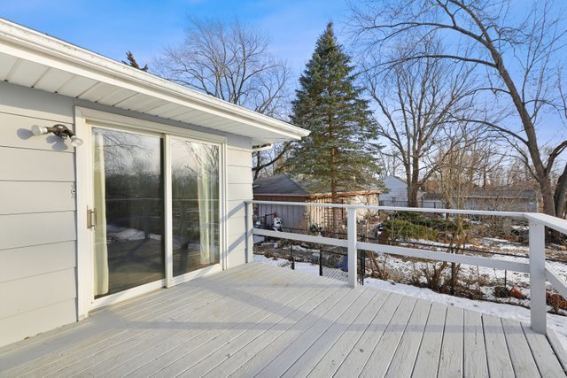 2394 Elm Road West Chicago, IL 60185 - Photo 21 of 28 a view of a balcony with wooden floor and fence
