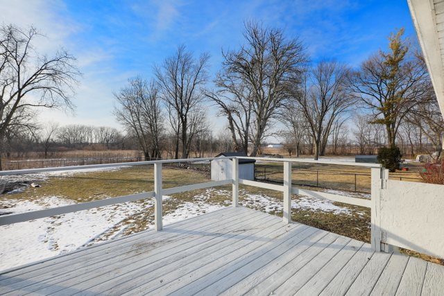 2394 Elm Road West Chicago, IL 60185 - Photo 22 of 28 a view of a swimming pool with wooden deck and palm trees