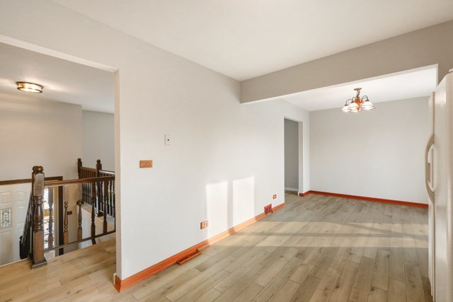 2394 Elm Road West Chicago, IL 60185 - Photo 5 of 28 a view of a livingroom with wooden floor