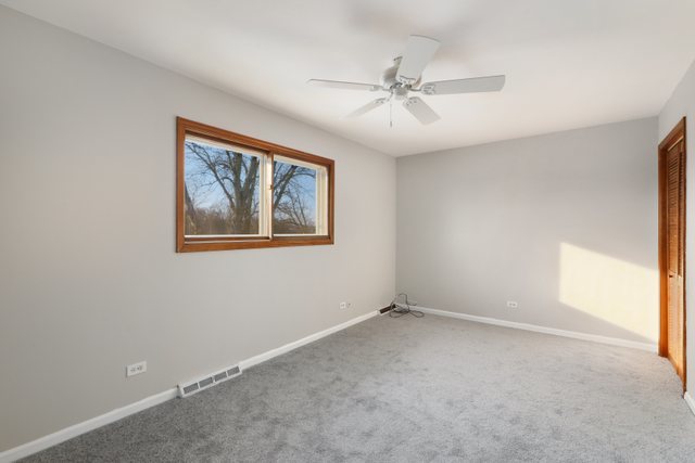 2394 Elm Road West Chicago, IL 60185 - Photo 10 of 28 a view of an empty room with a window