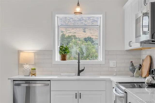 a kitchen with a sink and a window