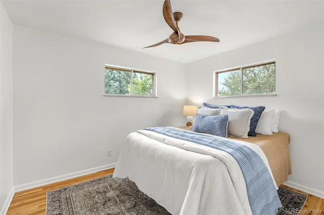 a bedroom with bed and a window