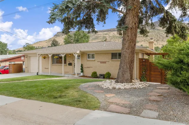 front view of a house with a yard