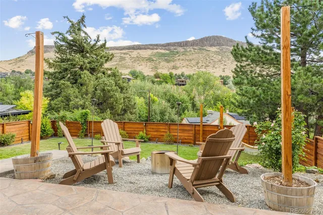 a view of a dining room with furniture and a window