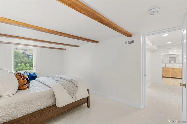 a bathroom with a tub and a bathroom