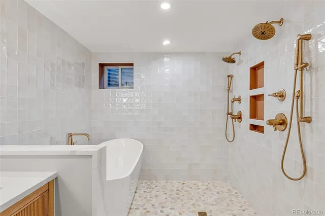 a view of a patio with a table and chairs under an umbrella