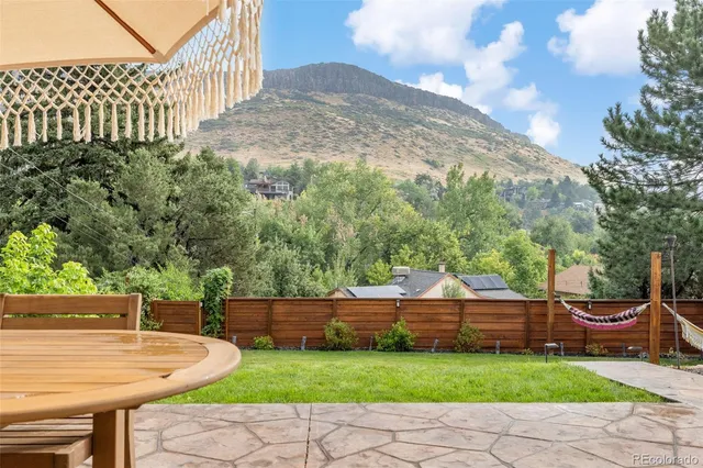 an aerial view of a house with a yard and garden