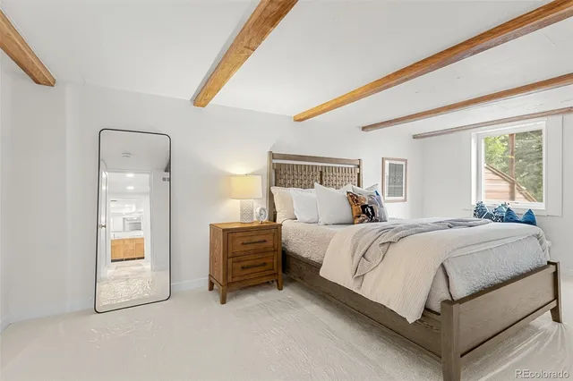 a bed room with a bed and window