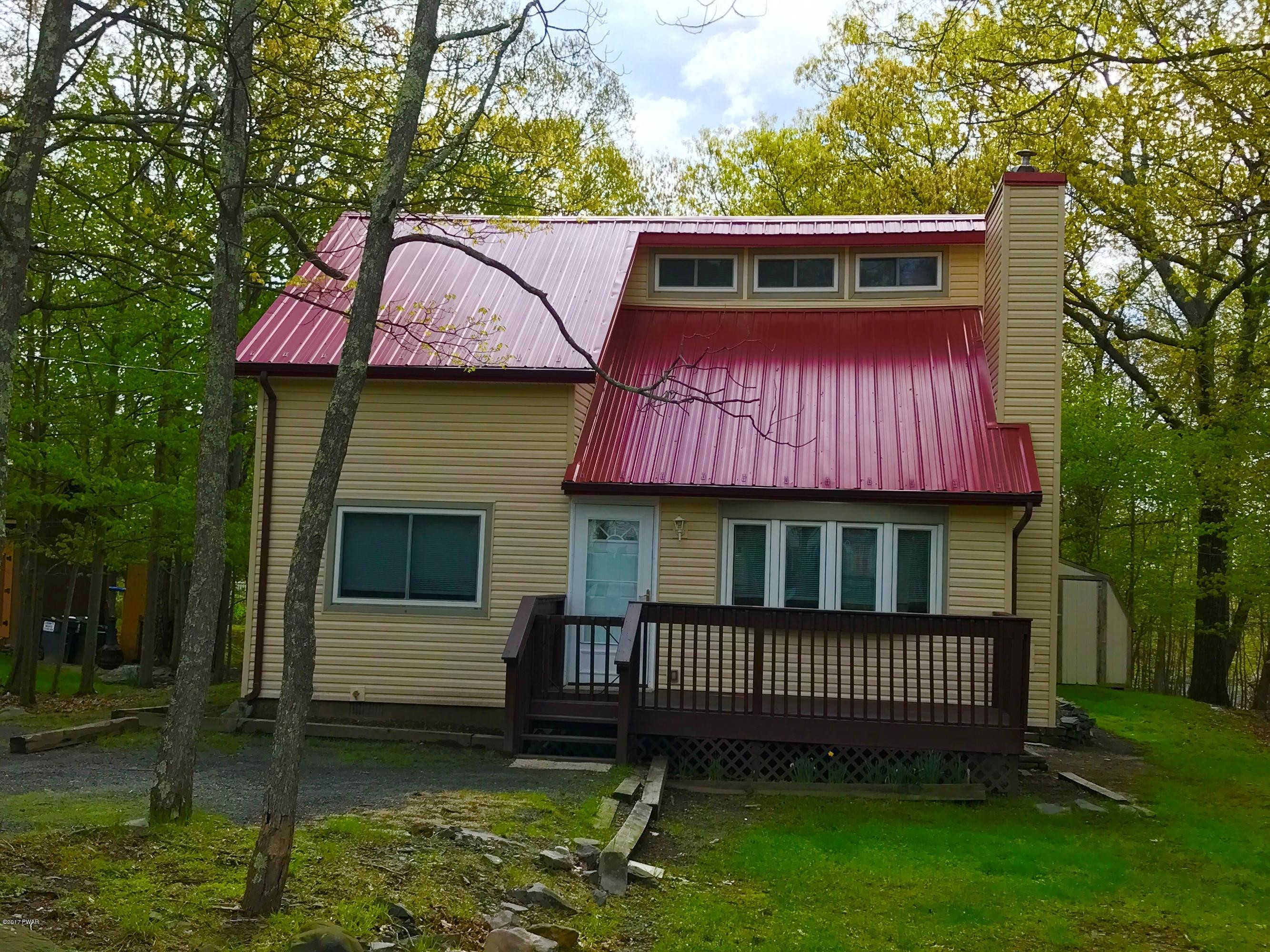 130 Stamford Road Dingmans Ferry, PA 18328 - Photo 2 of 25 a view of a house with a deck