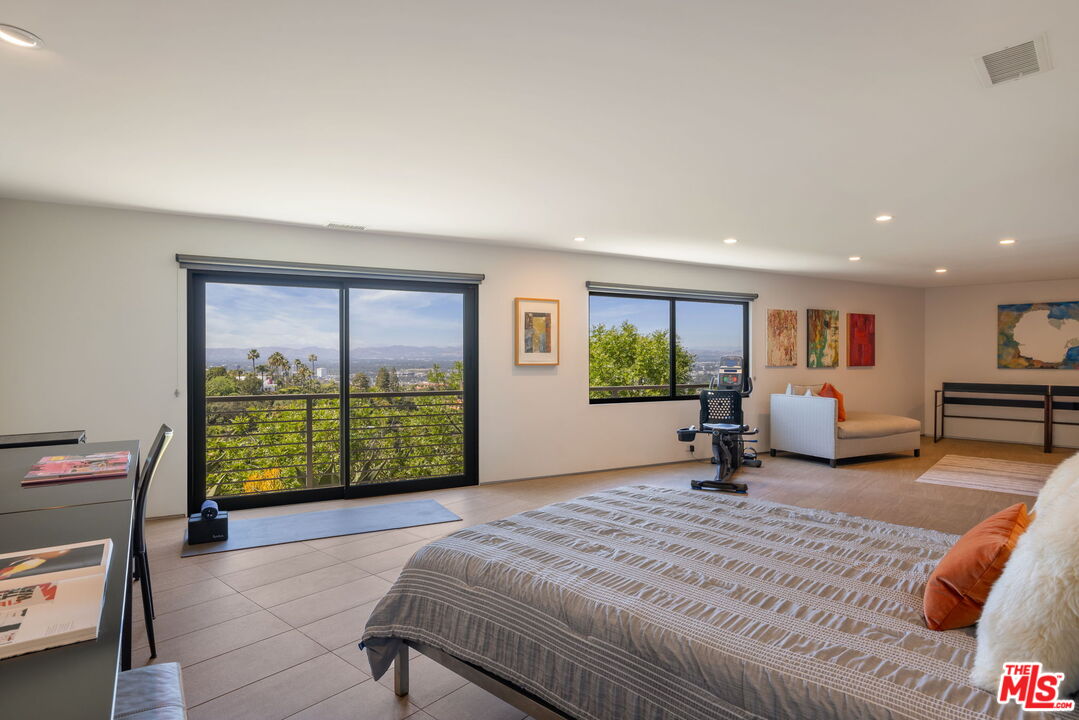 3337 Beverly Ranch Road Beverly Hills, CA 90210 - Photo 31 of 36 a bed room with a bed and a window